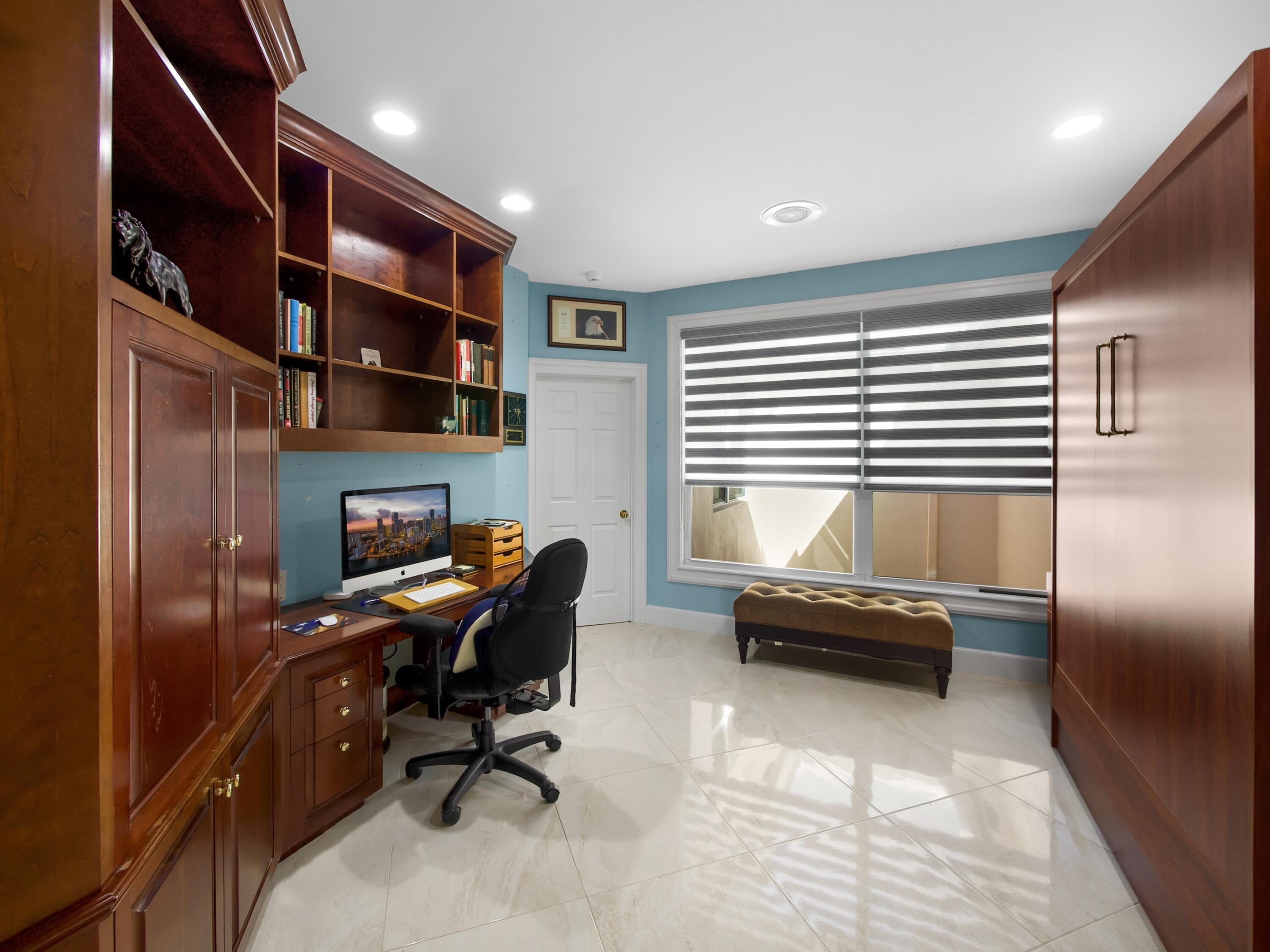 202 Orange Tree Drive, Unit I Atlantis, FL 33462 - Photo 14 of 19 a livingroom with workspace window and a couch