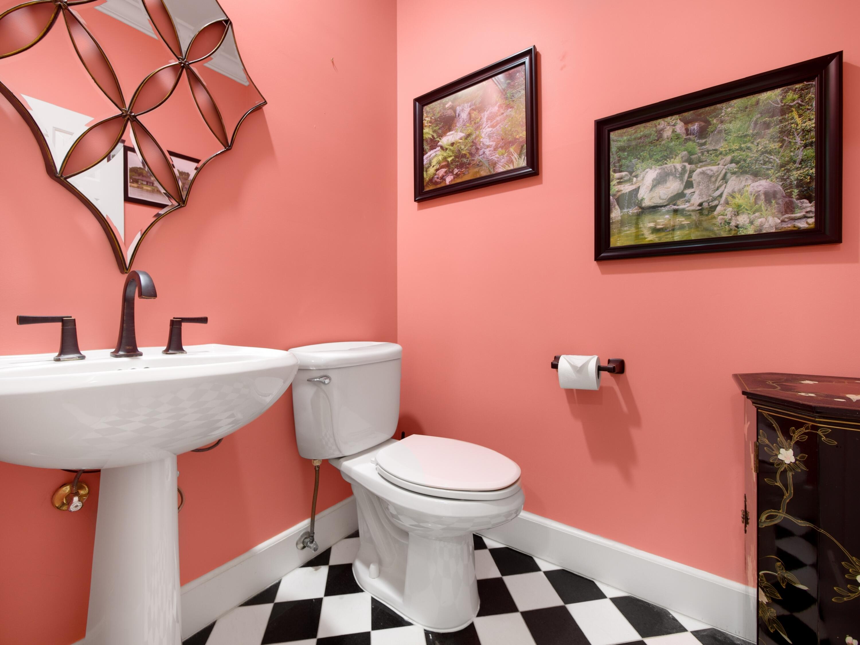 202 Orange Tree Drive, Unit I Atlantis, FL 33462 - Photo 15 of 19 a bathroom with a sink a toilet and a mirror