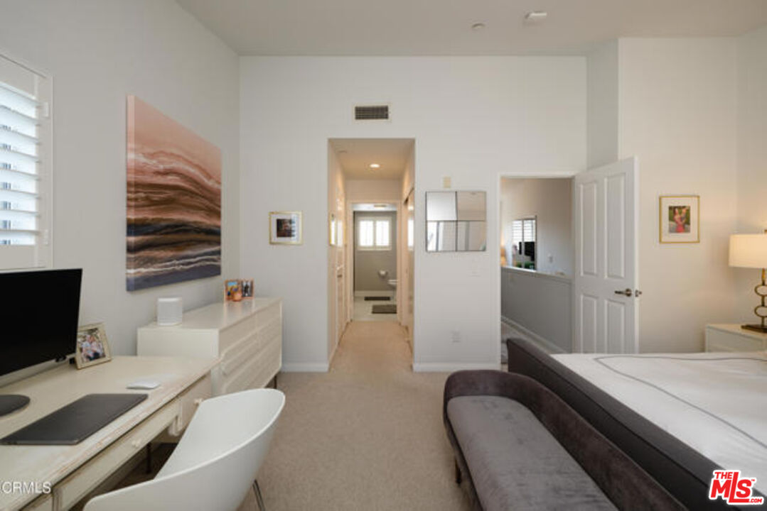 10918 Morrison Street, Unit 12 North Hollywood, CA 91601 - Photo 14 of 28 a bedroom with a bed and a television