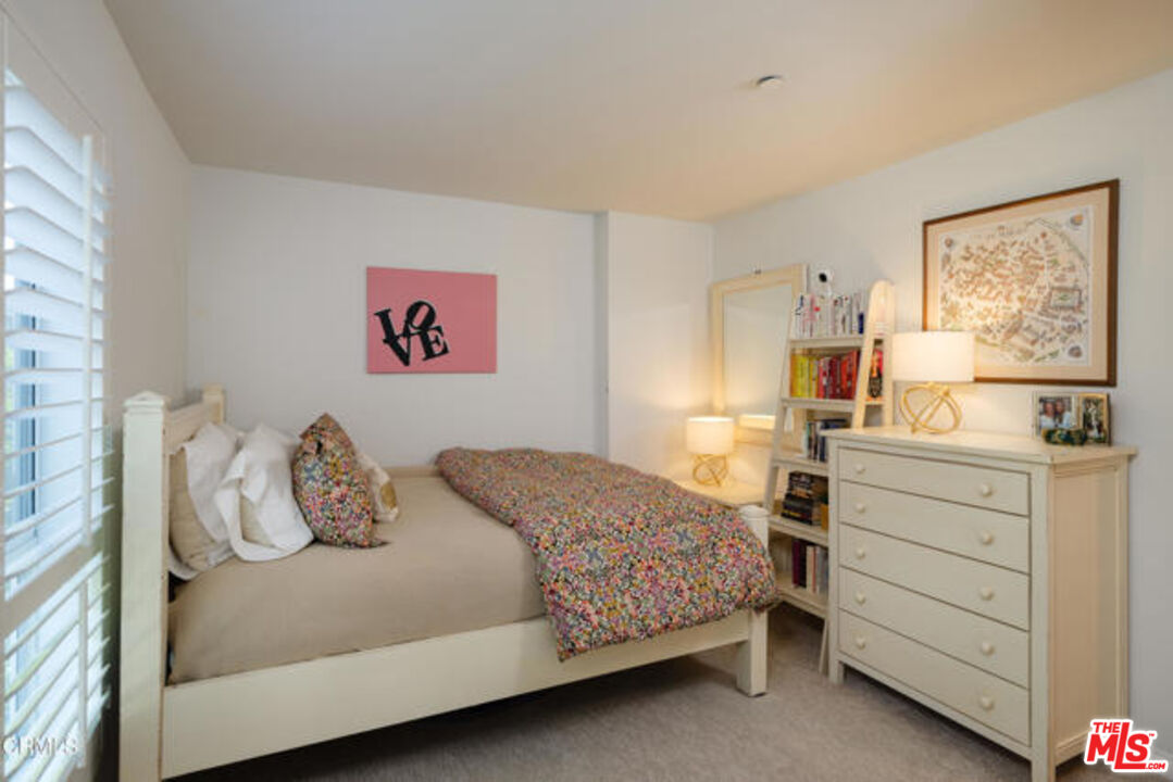 10918 Morrison Street, Unit 12 North Hollywood, CA 91601 - Photo 15 of 28 a bedroom with a bed and a window