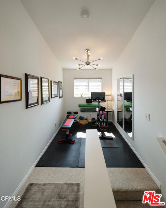 10918 Morrison Street, Unit 12 North Hollywood, CA 91601 - Photo 18 of 28 a living room with furniture and a chandelier