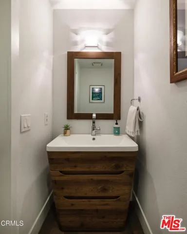 a bathroom with a sink toilet tub and shower