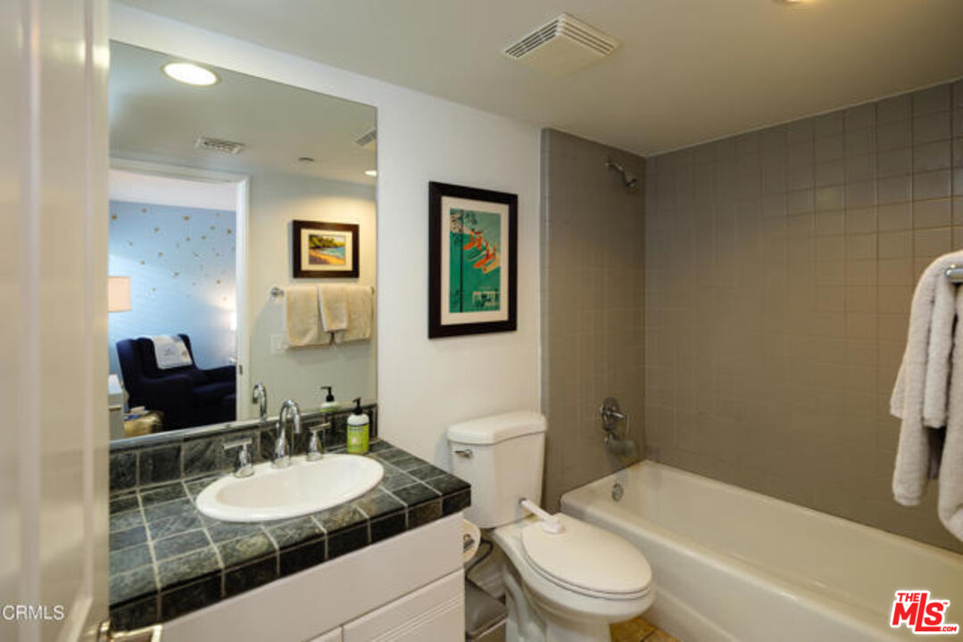 10918 Morrison Street, Unit 12 North Hollywood, CA 91601 - Photo 20 of 28 a bathroom with a sink toilet tub and shower