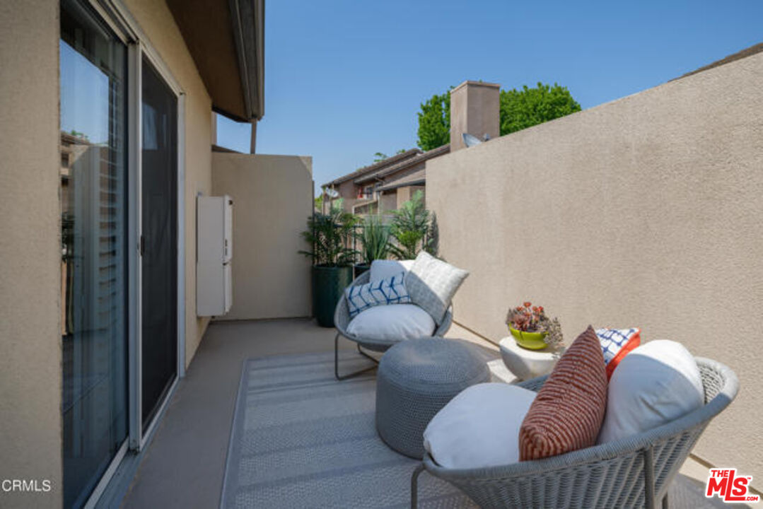 10918 Morrison Street, Unit 12 North Hollywood, CA 91601 - Photo 26 of 28 a view of balcony and couch