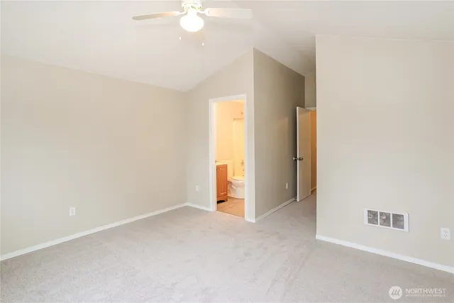 an empty room with a bathroom