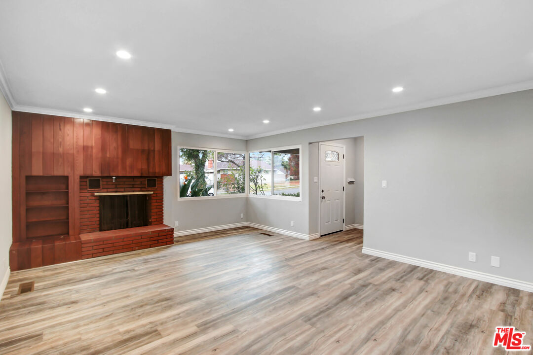 3324 Grampion Road Riverside, CA 92507 - Photo 11 of 11 a view of kitchen with kitchen island wooden floor center island and cabinets