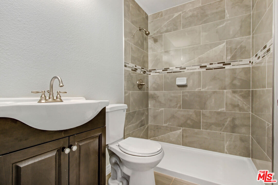 3324 Grampion Road Riverside, CA 92507 - Photo 6 of 11 a bathroom with a sink toilet and shower