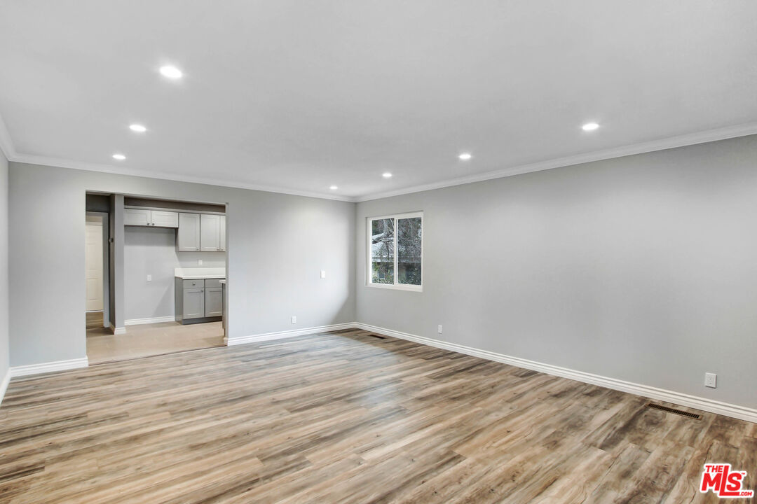 3324 Grampion Road Riverside, CA 92507 - Photo 10 of 11 a view of empty room with wooden floor