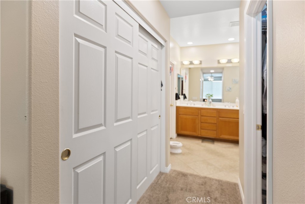 11643 Raptor Lane Desert Hot Springs, CA 92240 - Photo 14 of 37 a bathroom with a double vanity sink a mirror and a bathtub