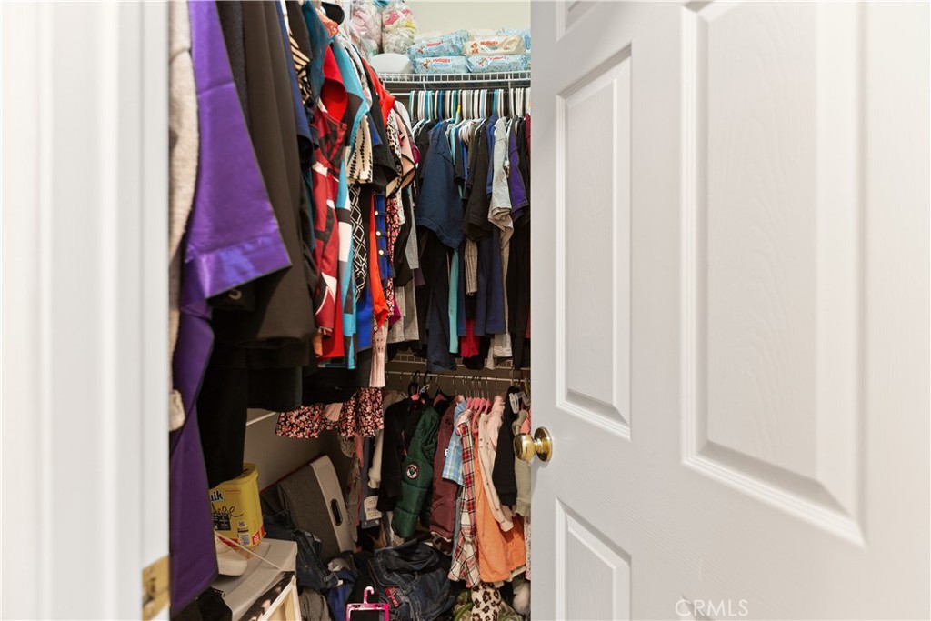 11643 Raptor Lane Desert Hot Springs, CA 92240 - Photo 15 of 37 a view of walk in closet with clothes