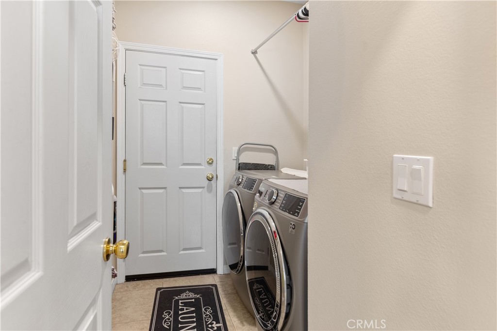 11643 Raptor Lane Desert Hot Springs, CA 92240 - Photo 20 of 37 a view of storage and utility room with washer and dryer