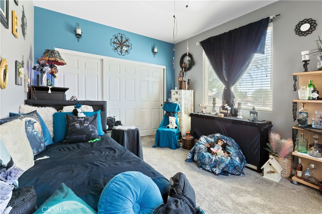 11643 Raptor Lane Desert Hot Springs, CA 92240 - Photo 28 of 37 a bed room with furniture and a window