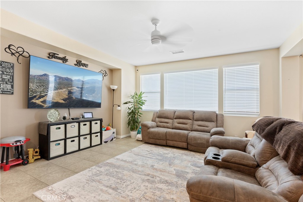 11643 Raptor Lane Desert Hot Springs, CA 92240 - Photo 3 of 37 a living room with furniture window and potted plant