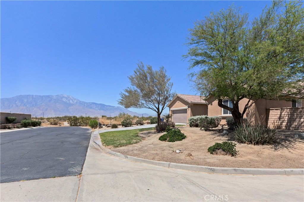 11643 Raptor Lane Desert Hot Springs, CA 92240 - Photo 33 of 37 a view of a house with a yard
