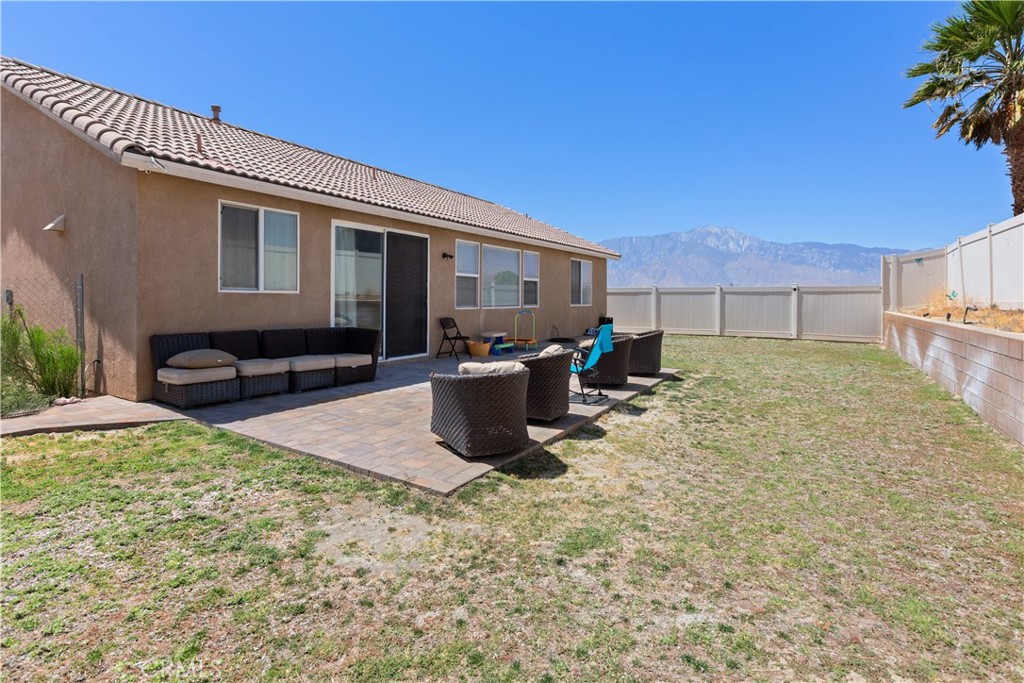 11643 Raptor Lane Desert Hot Springs, CA 92240 - Photo 36 of 37 a view of a house with backyard and sitting area