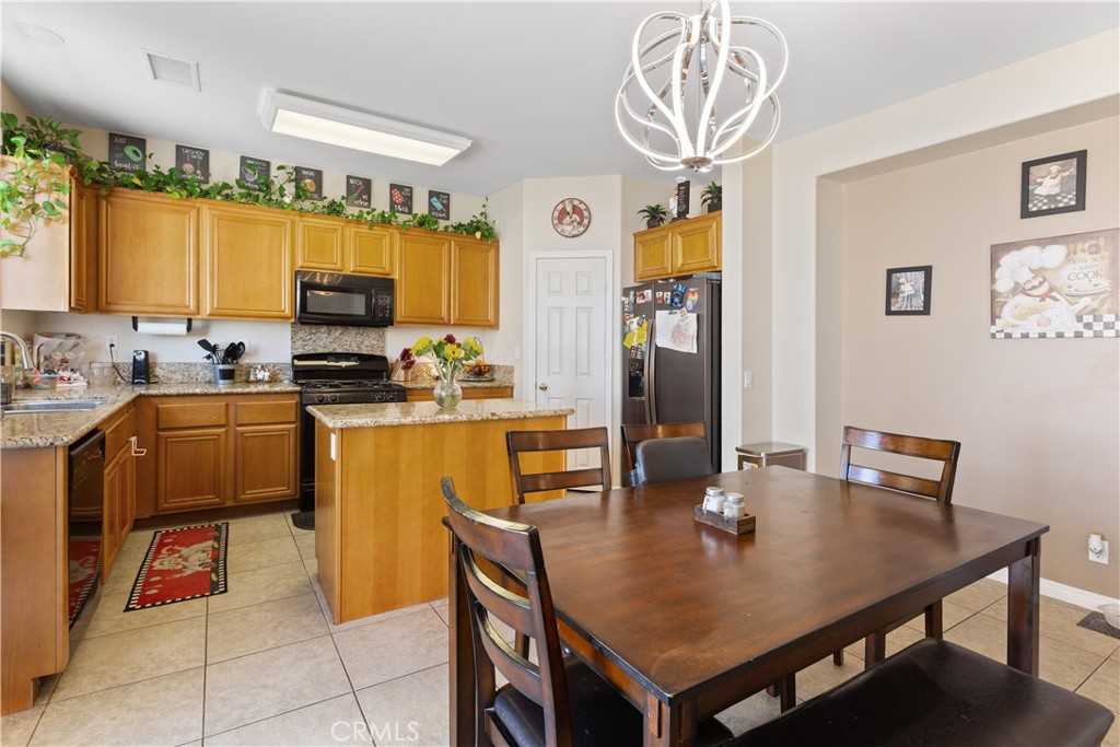 11643 Raptor Lane Desert Hot Springs, CA 92240 - Photo 6 of 37 a view of a dining room with furniture