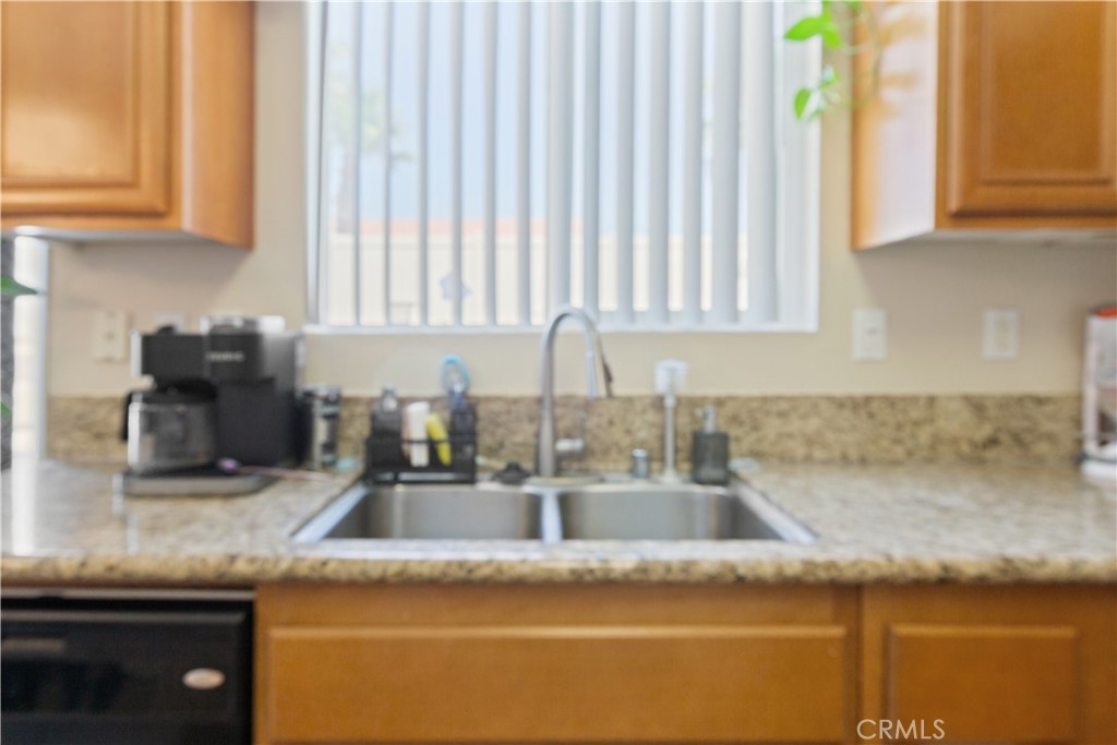 11643 Raptor Lane Desert Hot Springs, CA 92240 - Photo 8 of 37 a kitchen with granite countertop a sink and a stove