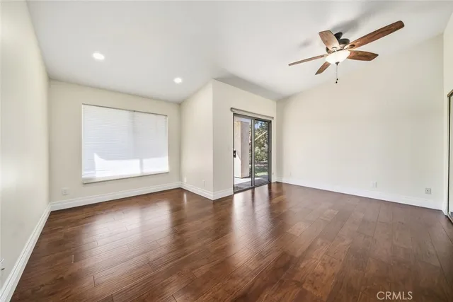 a view of an entryway with wooden floor