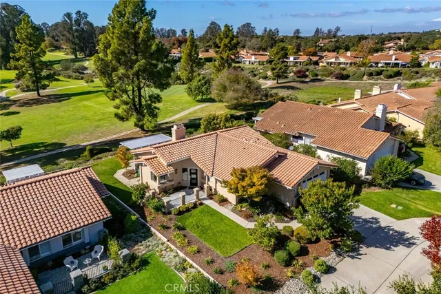 an aerial view of a house with a garden