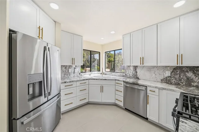 a kitchen with a stove and a microwave
