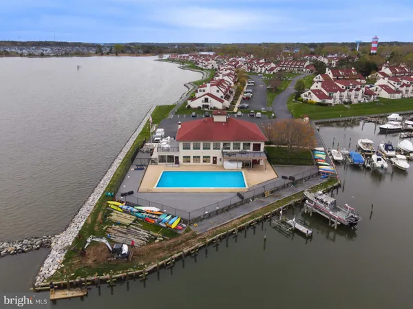 an aerial view of a house with a lake view