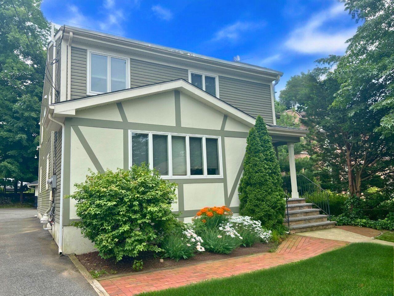 a front view of a house with a yard