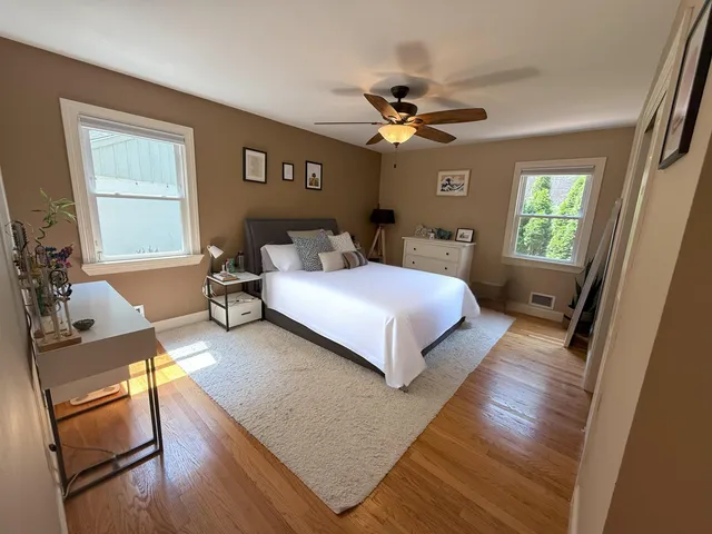 a bed room with a bed and a chandelier