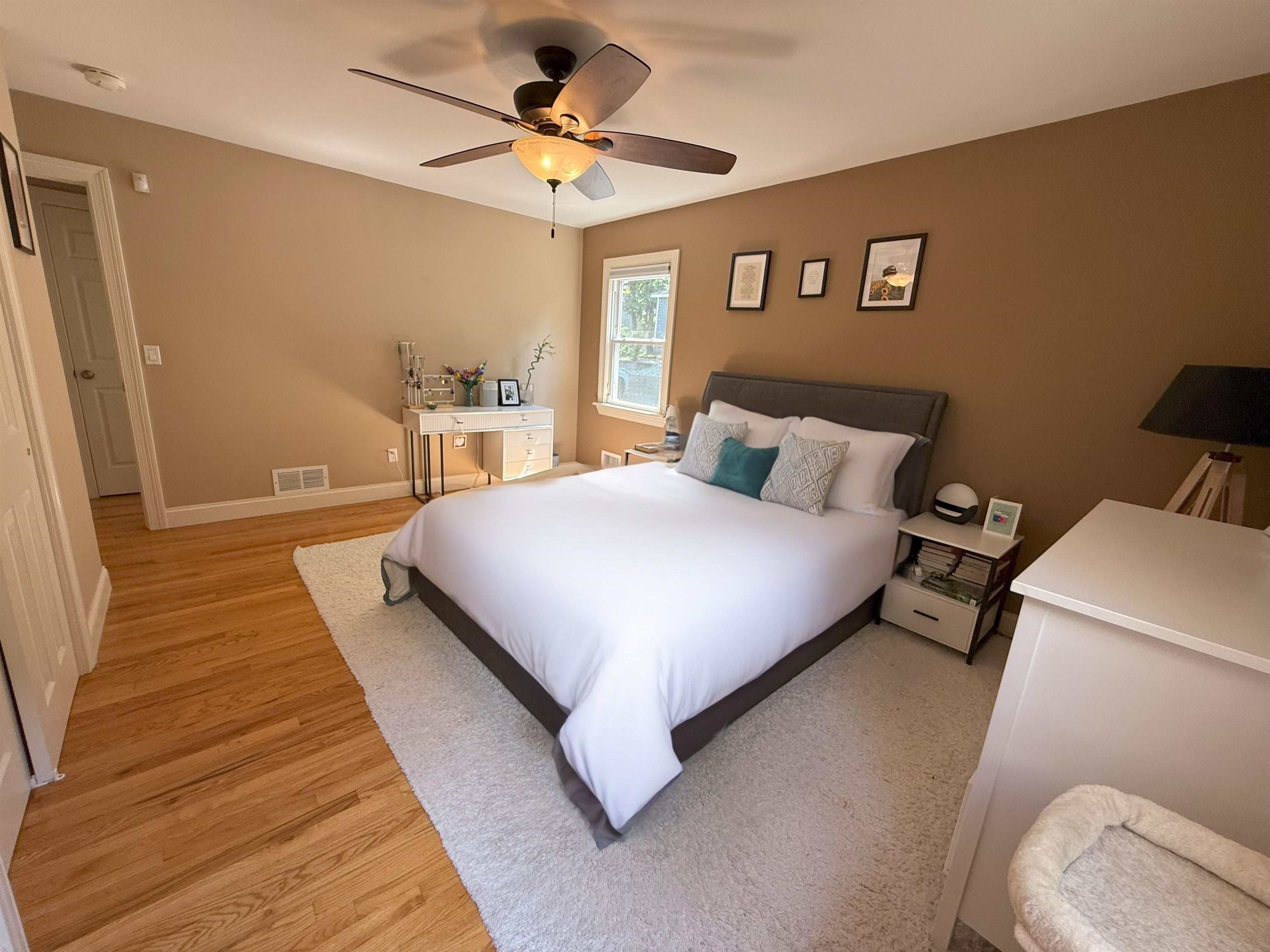 45 Garfield Place, Unit 1 (1ST FLOOR) Ridgewood, NJ 07450 - Photo 12 of 33 a bed room with a bed and a chandelier