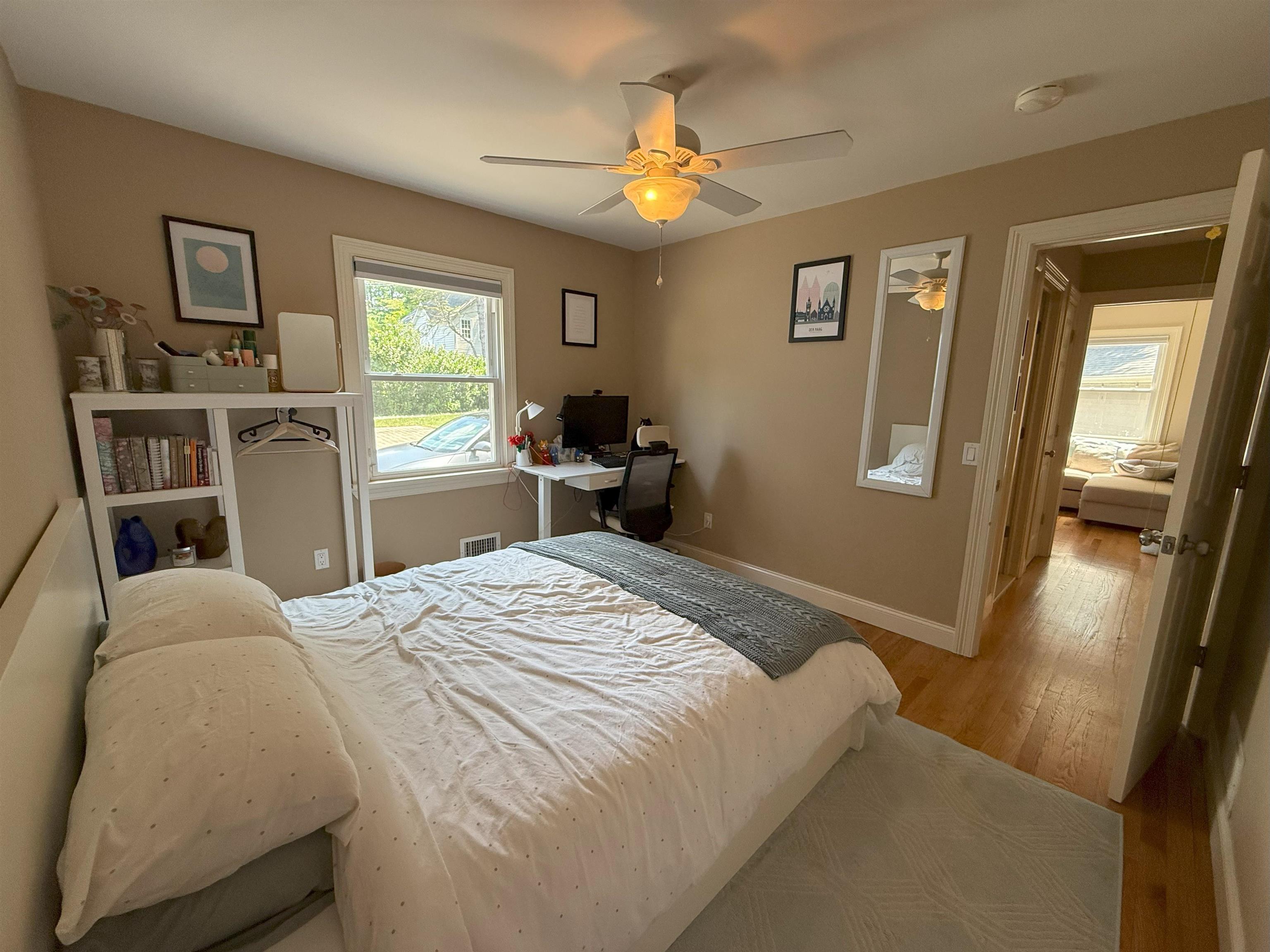 45 Garfield Place, Unit 1 (1ST FLOOR) Ridgewood, NJ 07450 - Photo 18 of 33 a bedroom with a bed and a chandelier