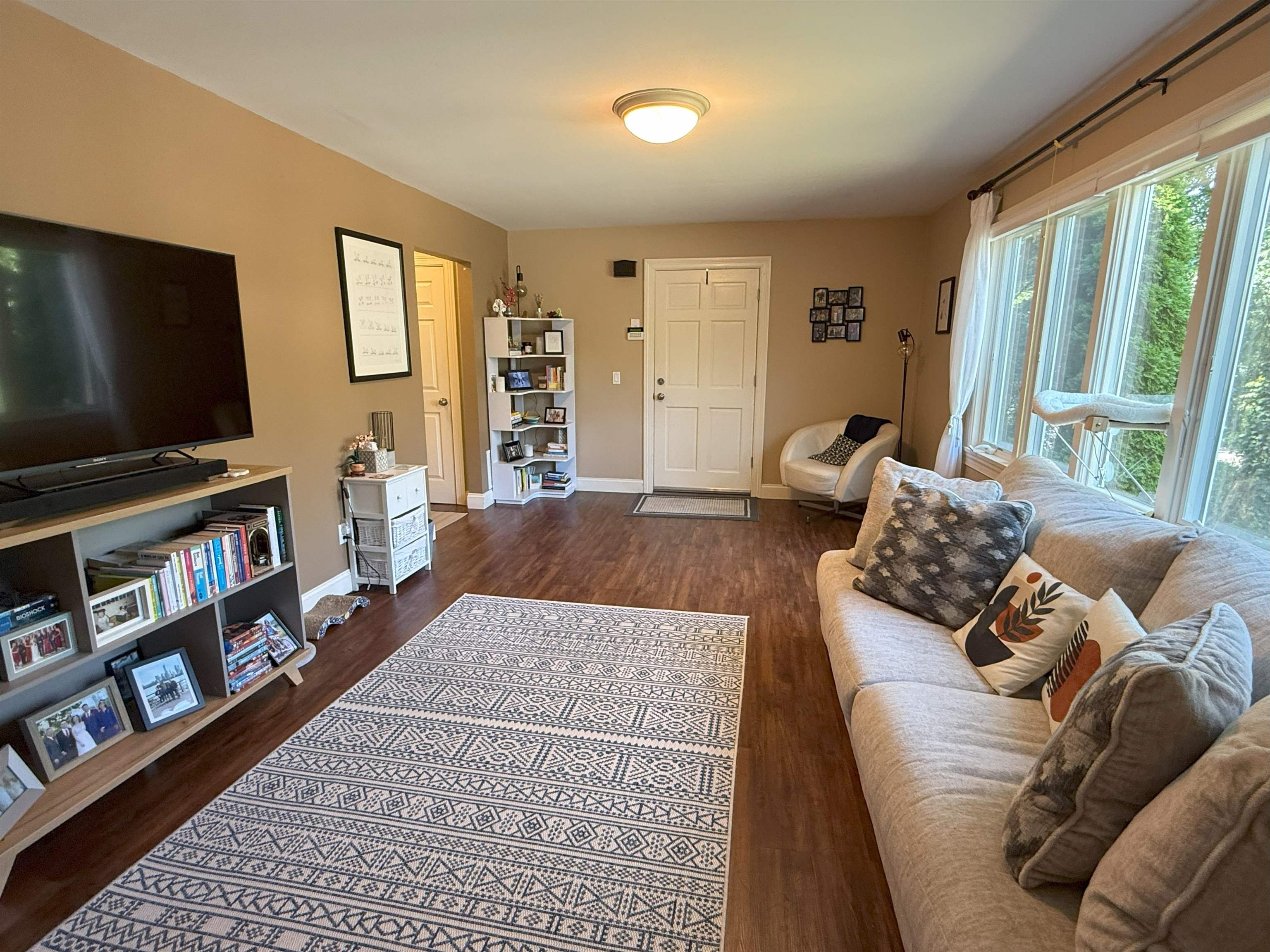 45 Garfield Place, Unit 1 (1ST FLOOR) Ridgewood, NJ 07450 - Photo 2 of 33 a living room with furniture and a flat screen tv