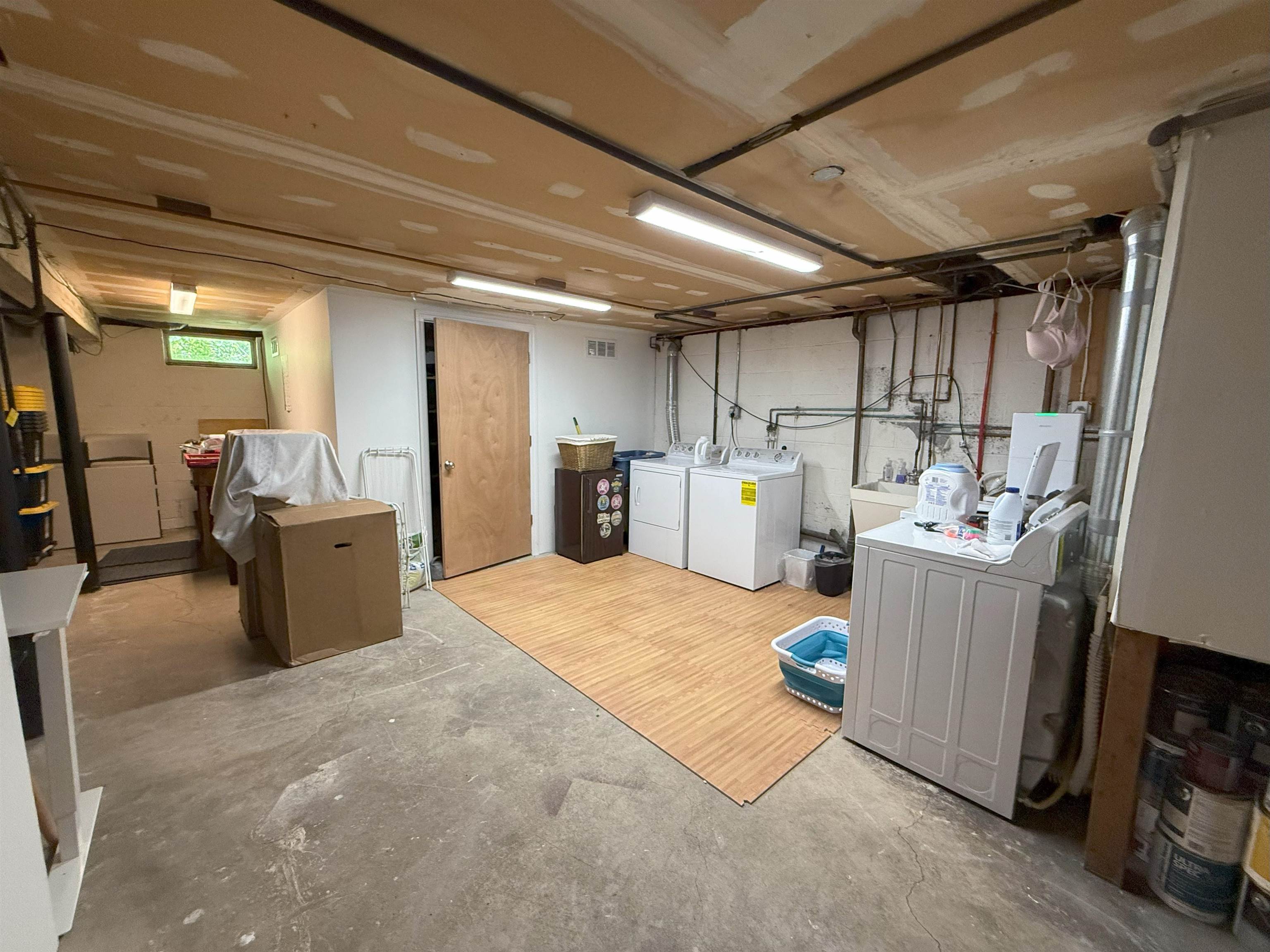45 Garfield Place, Unit 1 (1ST FLOOR) Ridgewood, NJ 07450 - Photo 22 of 33 a room with furniture and a refrigerator