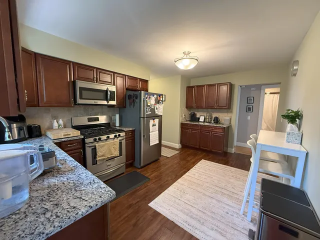 a workspace with furniture and wooden floor