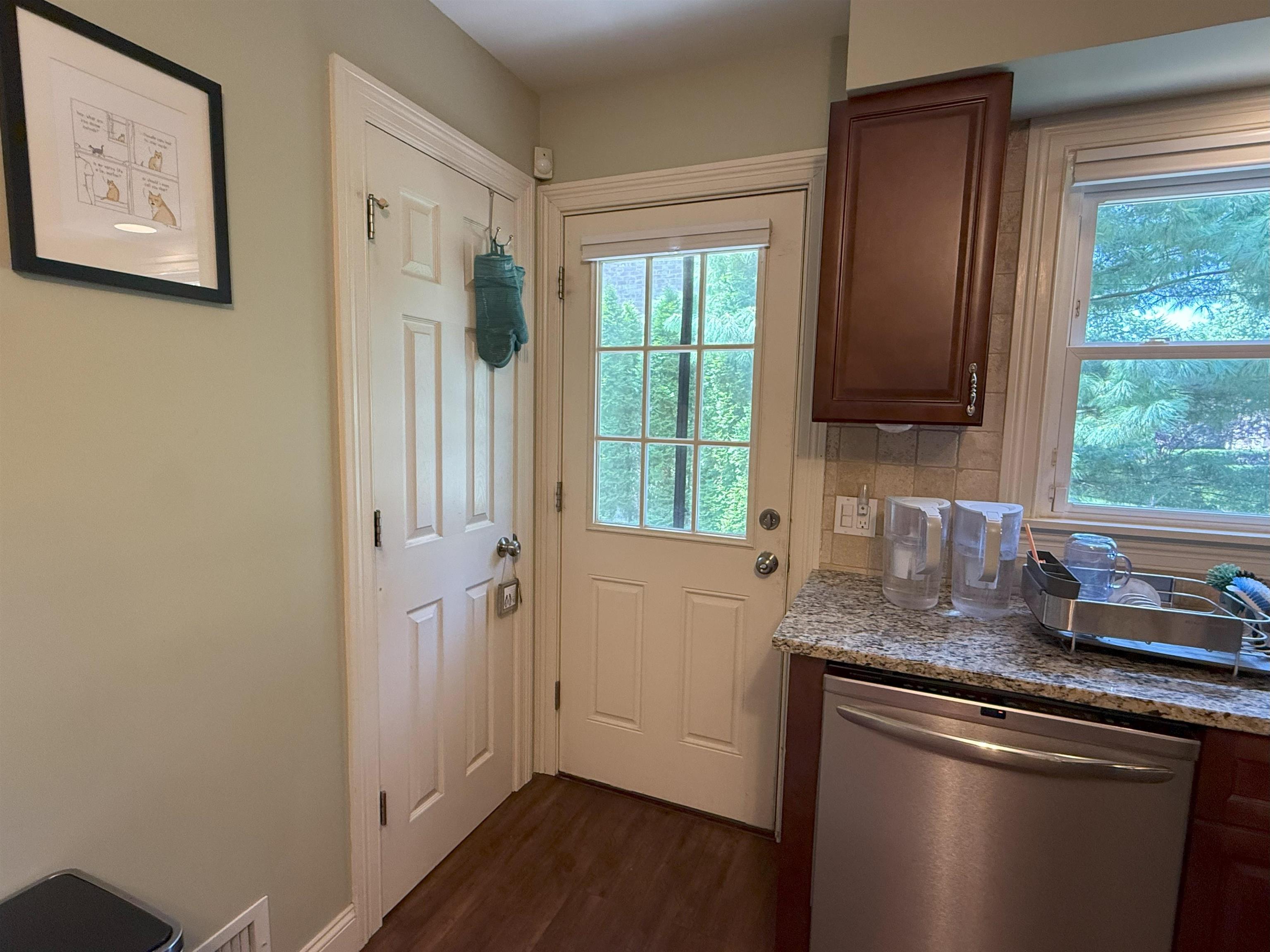 45 Garfield Place, Unit 1 (1ST FLOOR) Ridgewood, NJ 07450 - Photo 10 of 33 a kitchen with granite countertop cabinets stainless steel appliances a sink and a window