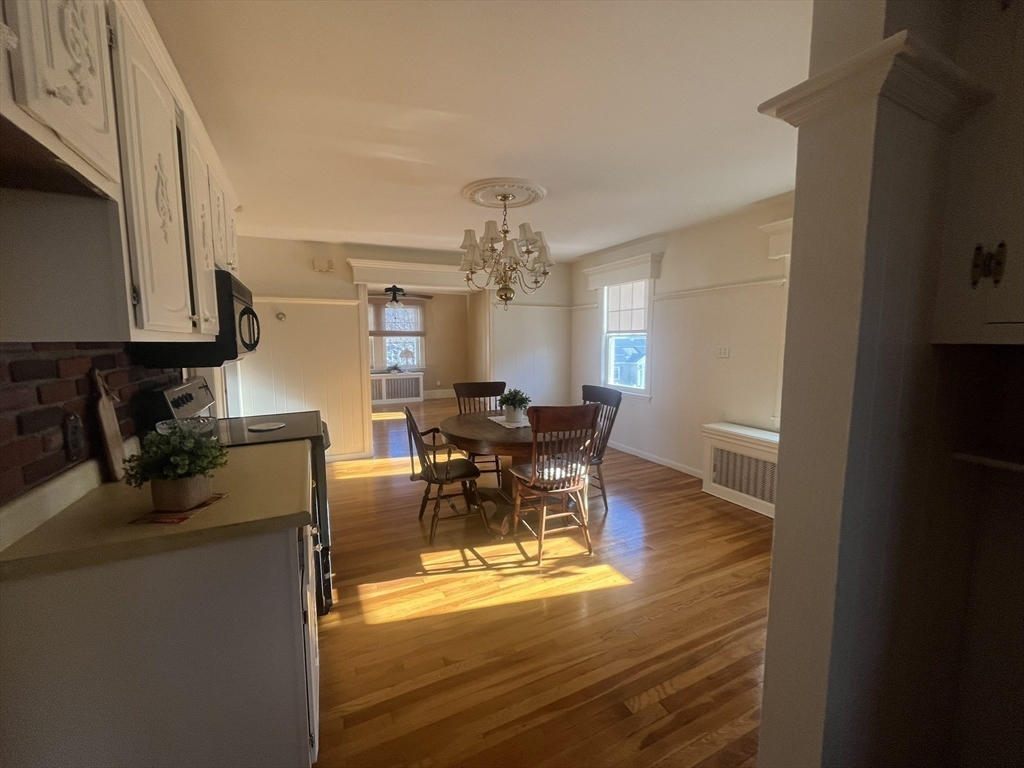 11 Sumner Road Salem, MA 01970 - Photo 19 of 37 a view of a dining room with furniture and a chandelier