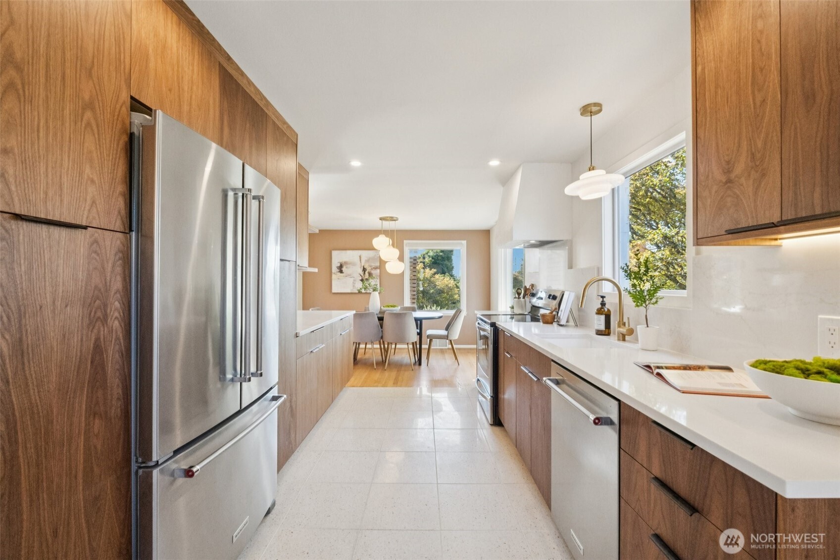 730 Northwest 73rd Street Seattle, WA 98117 - Photo 15 of 39 a large kitchen with a large window a refrigerator and a sink