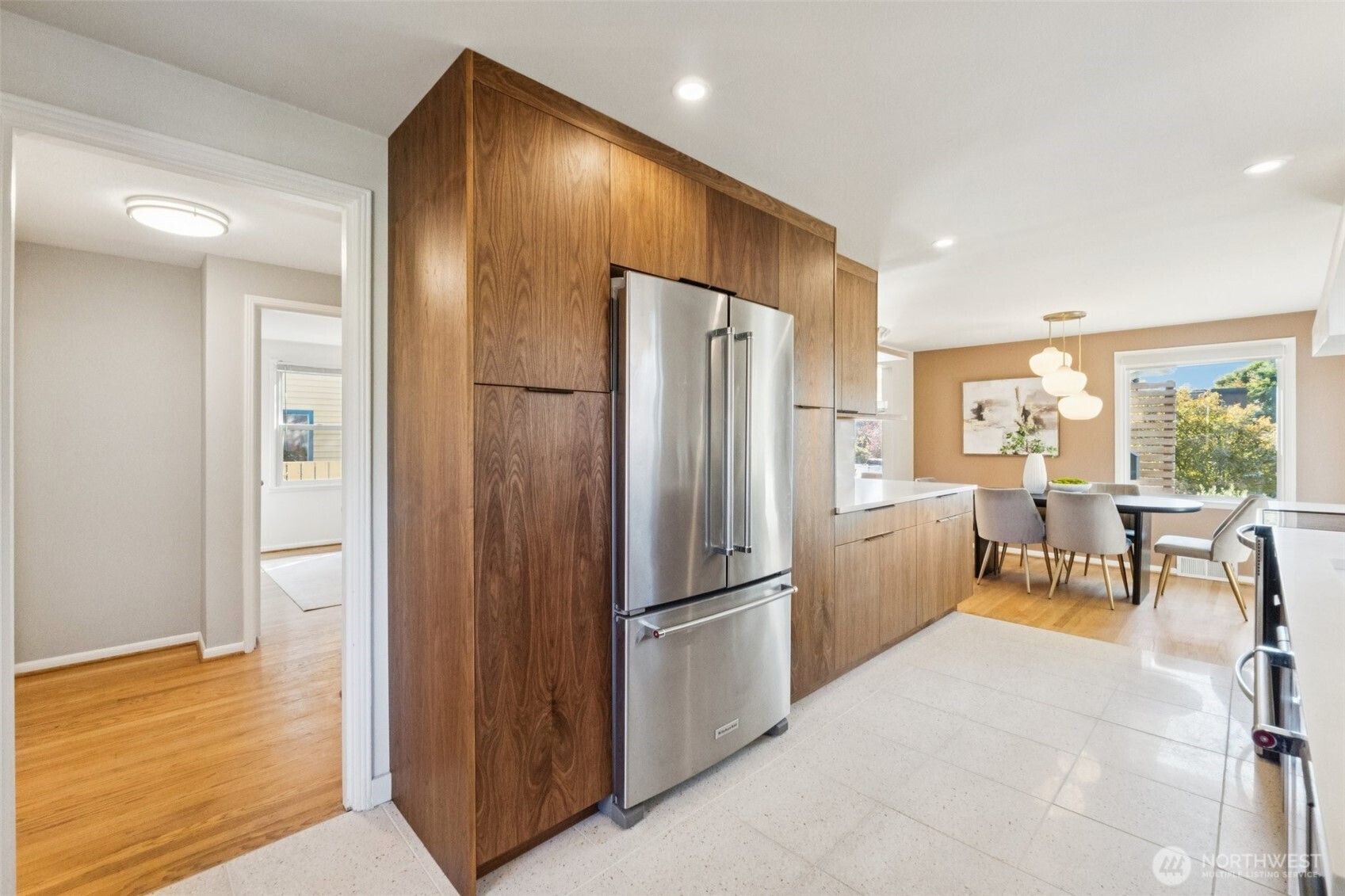 730 Northwest 73rd Street Seattle, WA 98117 - Photo 17 of 39 a kitchen with stainless steel appliances granite countertop a refrigerator and a stove top oven