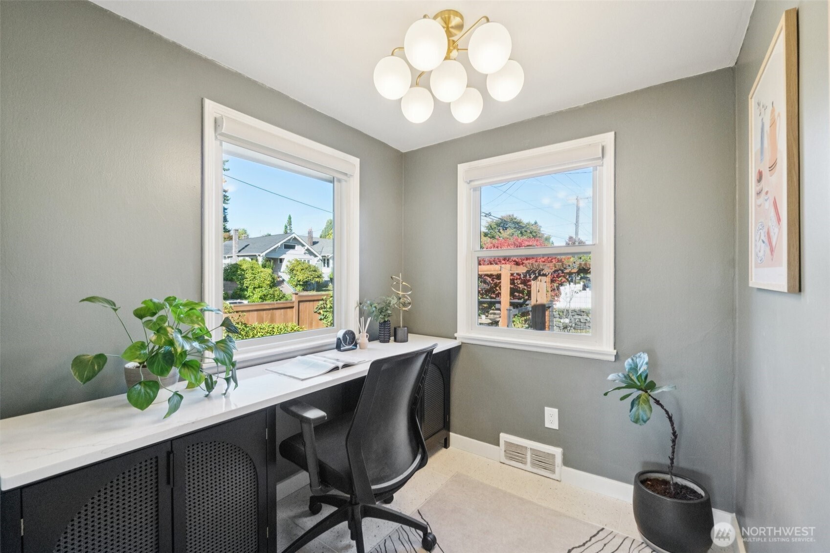 730 Northwest 73rd Street Seattle, WA 98117 - Photo 18 of 39 a dining room with furniture potted plants and wooden floor
