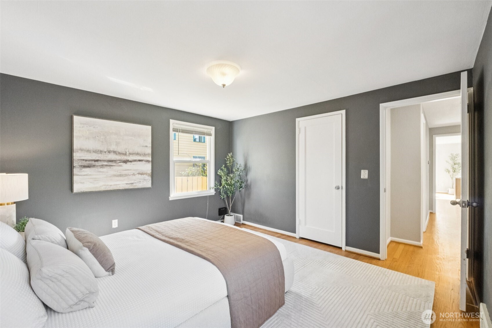 730 Northwest 73rd Street Seattle, WA 98117 - Photo 22 of 39 a bedroom with a large bed and bedroom view