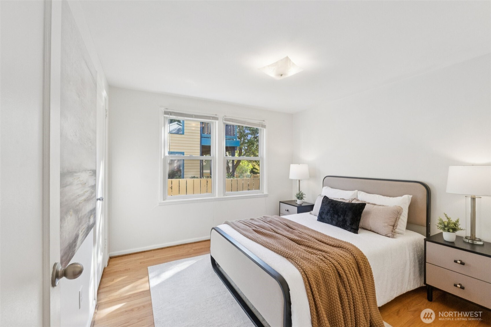730 Northwest 73rd Street Seattle, WA 98117 - Photo 23 of 39 a bedroom with a bed and a window