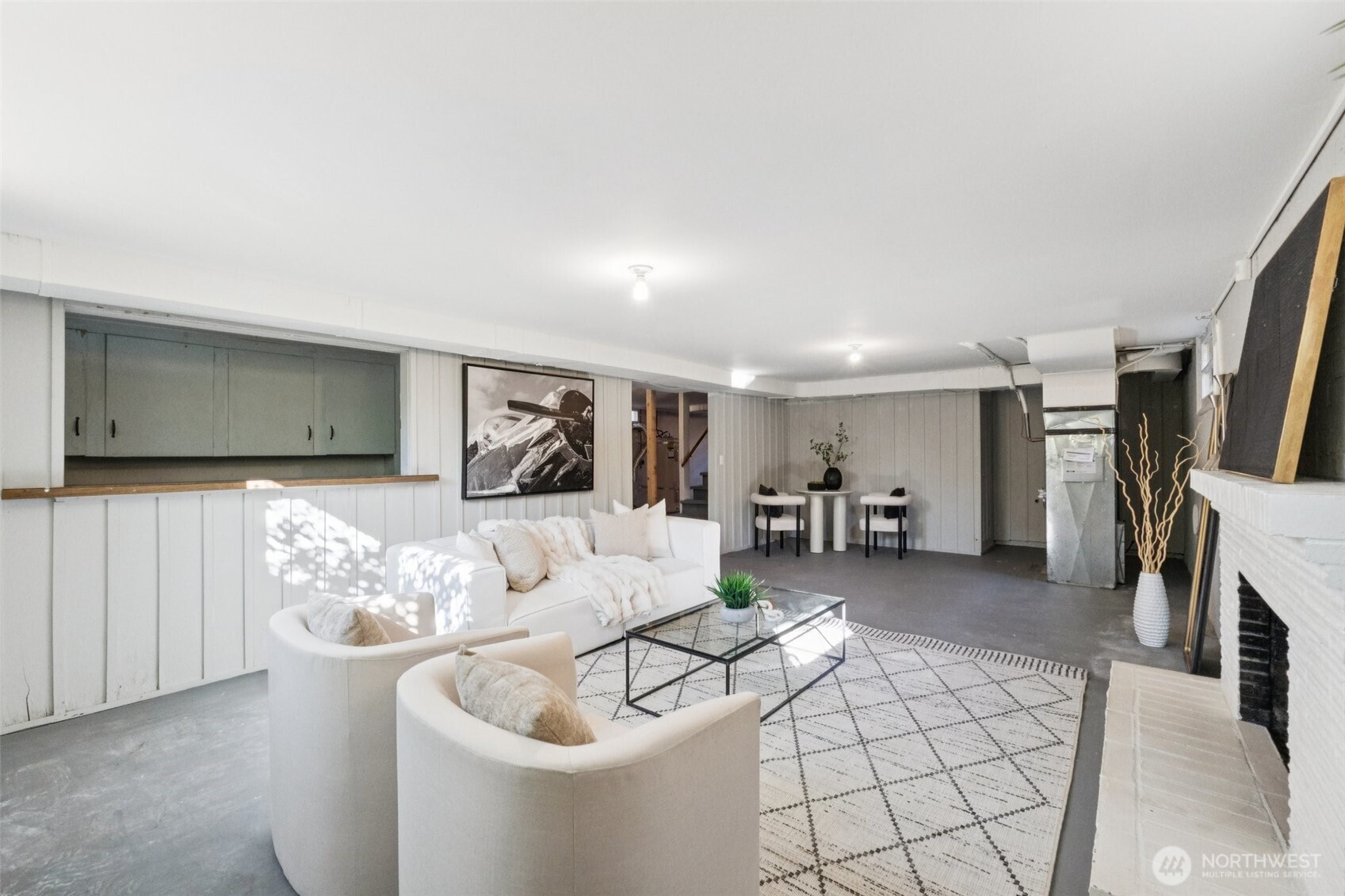 730 Northwest 73rd Street Seattle, WA 98117 - Photo 26 of 39 a living room with furniture and a flat screen tv