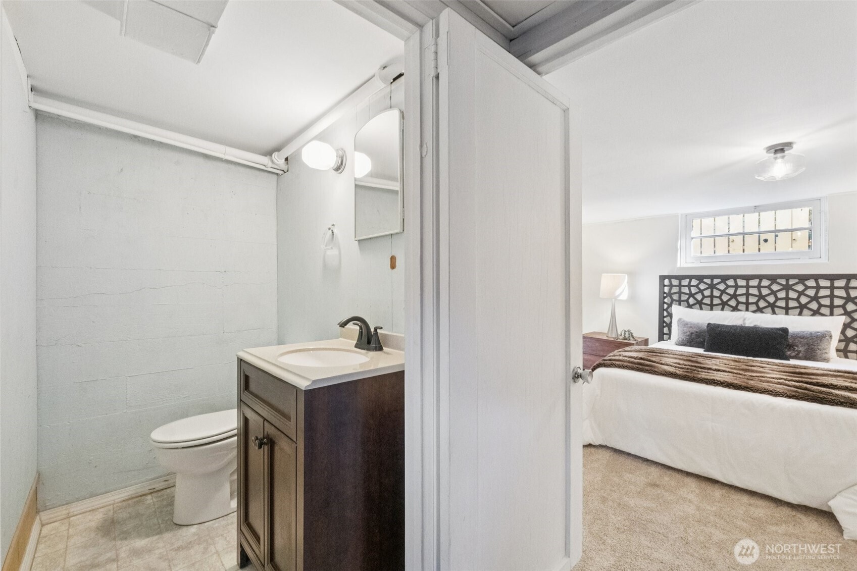 730 Northwest 73rd Street Seattle, WA 98117 - Photo 32 of 39 a bathroom with a sink toilet and a mirror