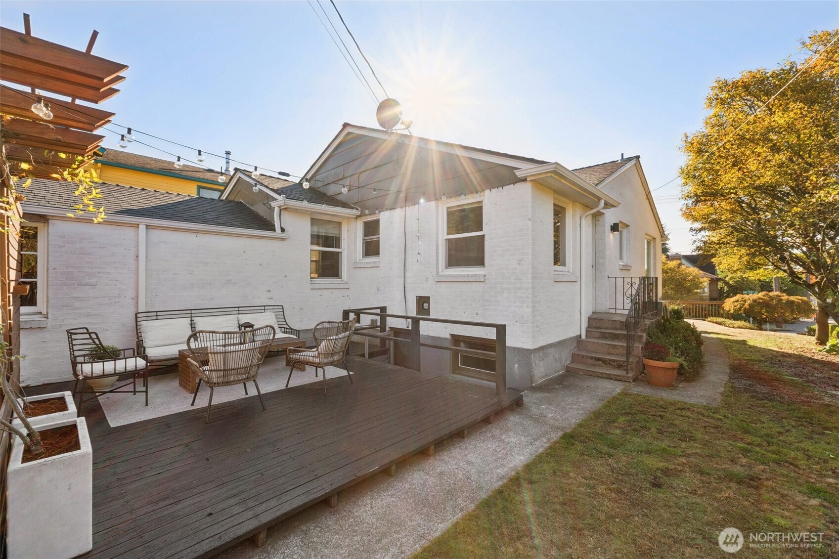 730 Northwest 73rd Street Seattle, WA 98117 - Photo 35 of 39 a view of a patio with couches chairs and wooden floor