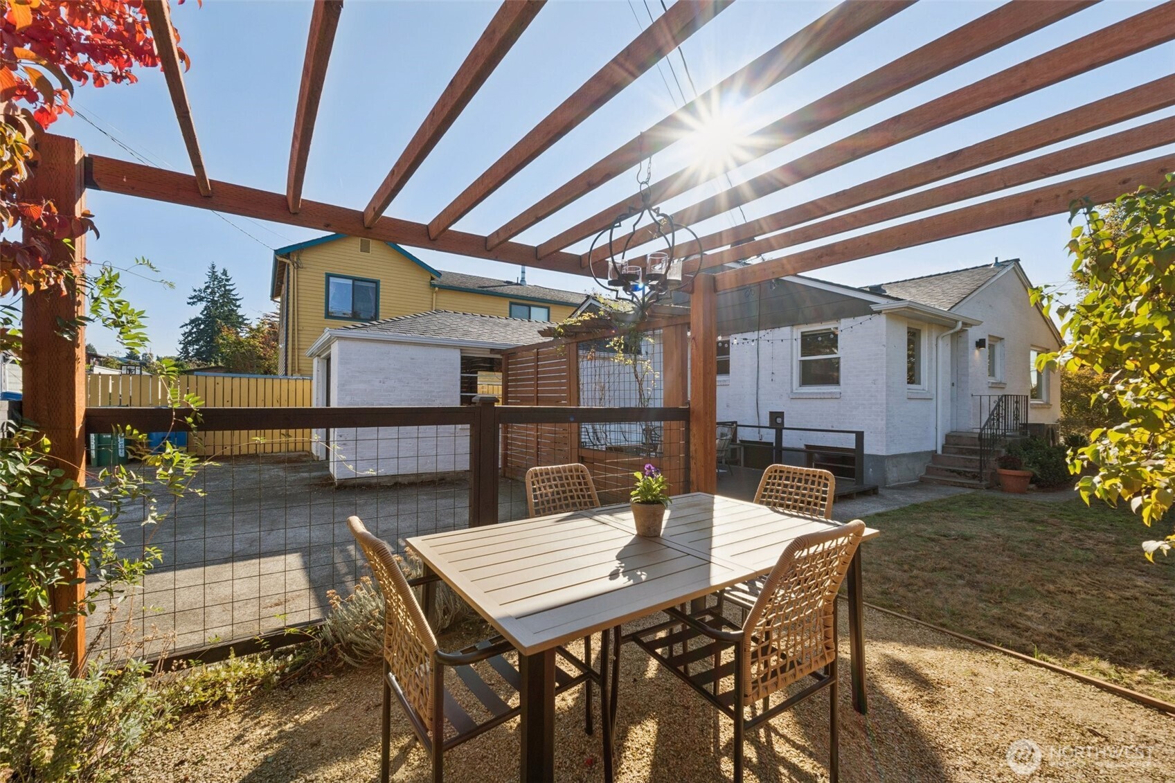 730 Northwest 73rd Street Seattle, WA 98117 - Photo 36 of 39 a view of a patio with a table and chairs and potted plants