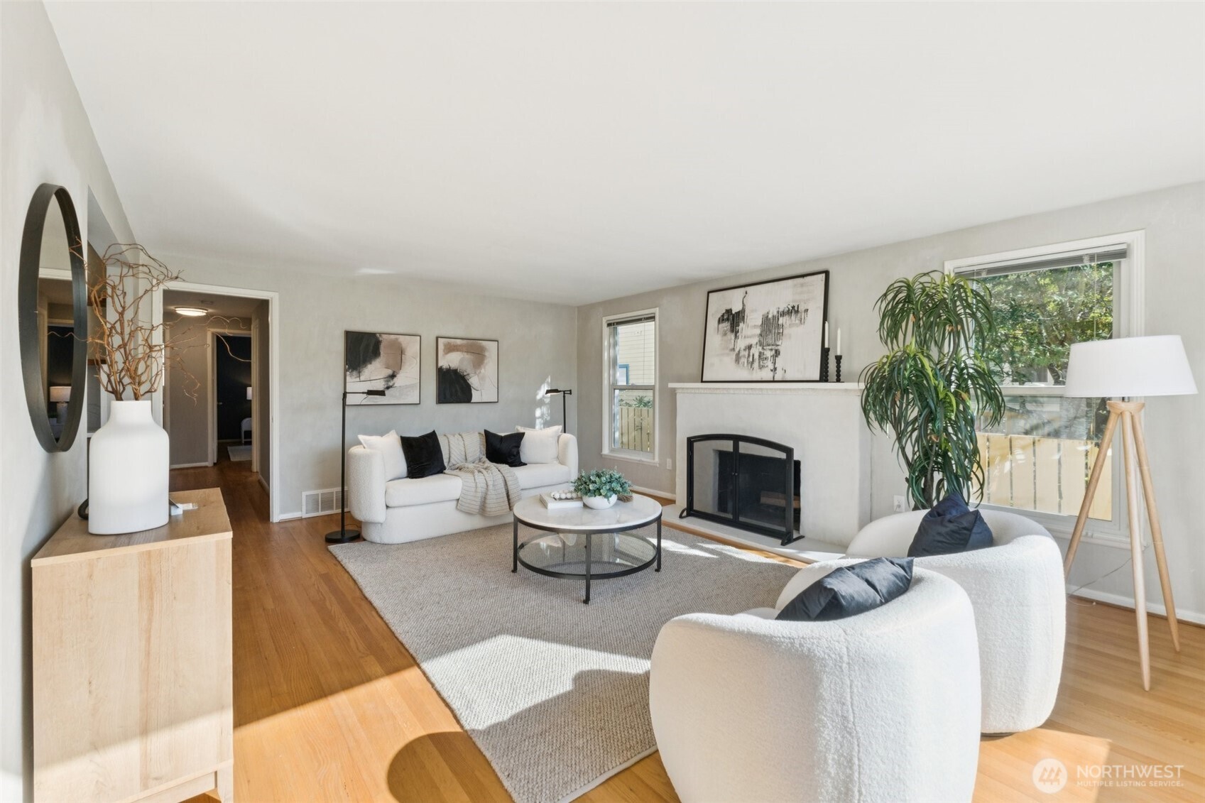 730 Northwest 73rd Street Seattle, WA 98117 - Photo 6 of 39 a living room with furniture a fireplace and a large window