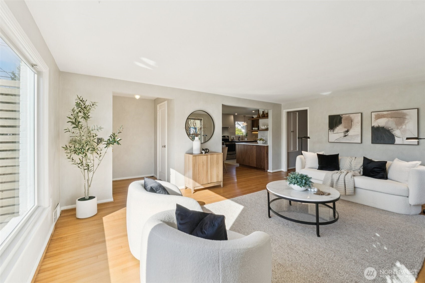 730 Northwest 73rd Street Seattle, WA 98117 - Photo 7 of 39 a living room with furniture potted plant and kitchen view