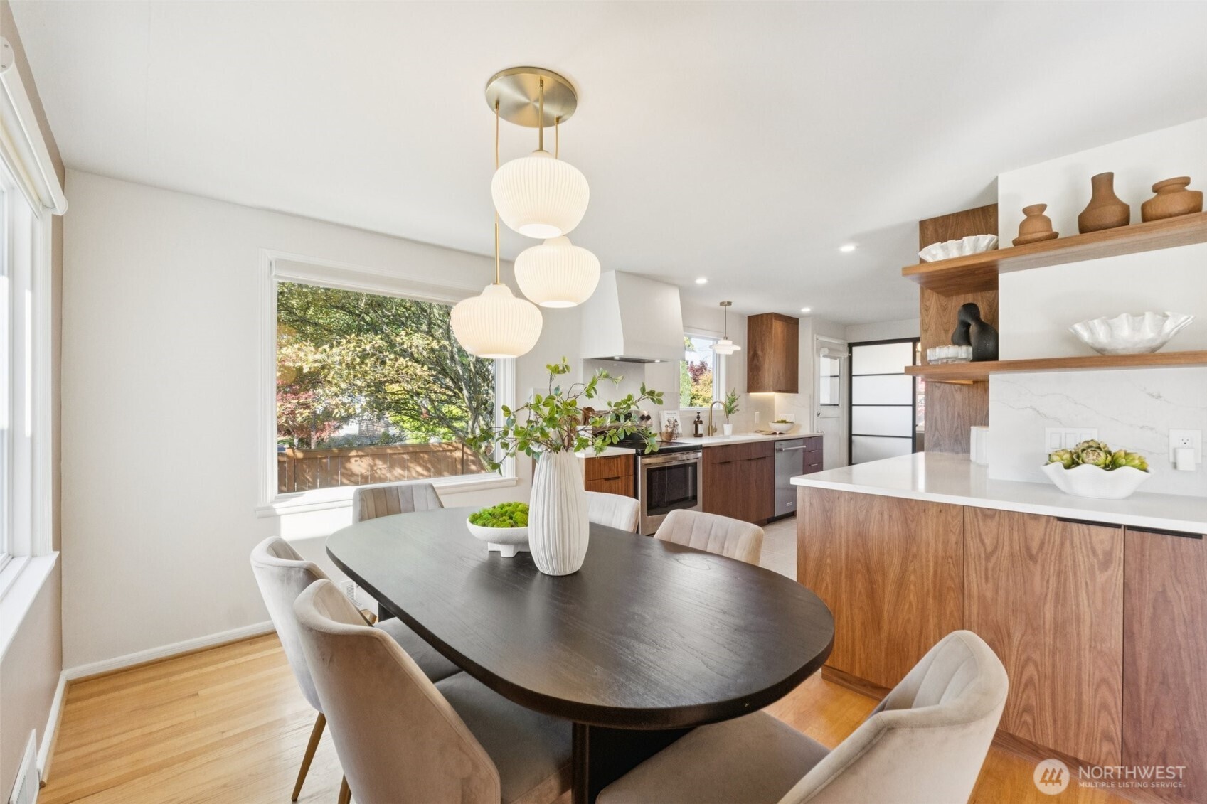 730 Northwest 73rd Street Seattle, WA 98117 - Photo 10 of 39 a view of a dining room with furniture and wooden floor
