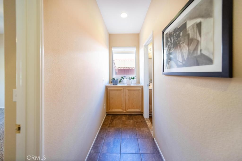 29063 Boulder Crest Way Menifee, CA 92584 - Photo 18 of 40 Hall to downstairs bed/bath