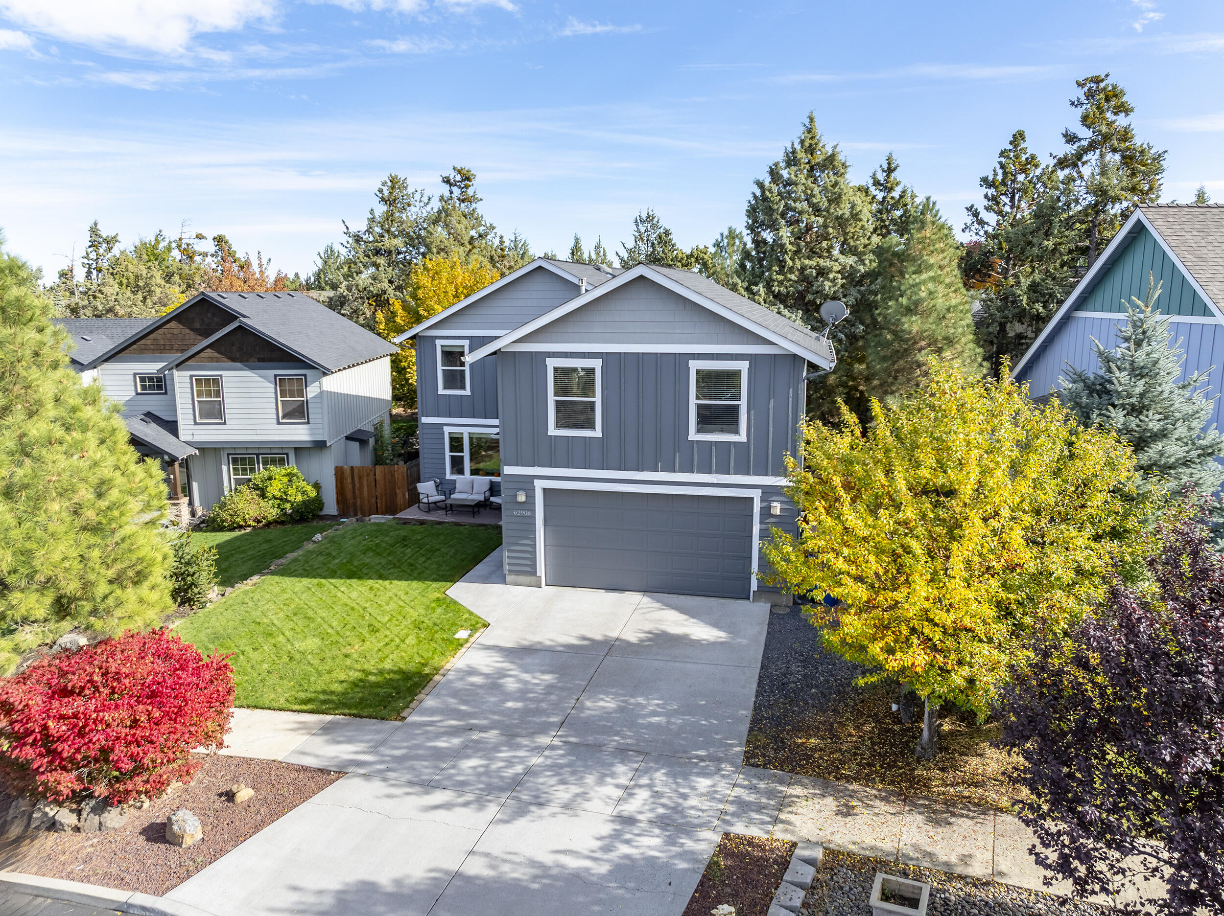 62906 Bilyeu Way Bend, OR 97701 - Photo 90 of 100 a front view of a house with a yard and garage