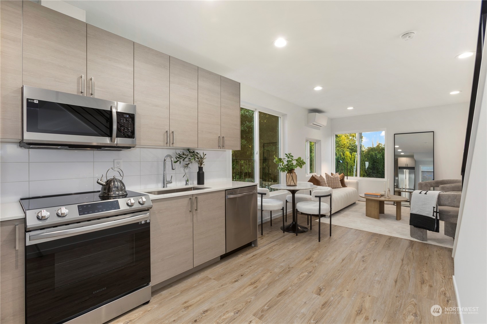 3102 South Walden Street Seattle, WA 98144 - Photo 12 of 35 a kitchen with a sink stainless steel appliances and cabinets