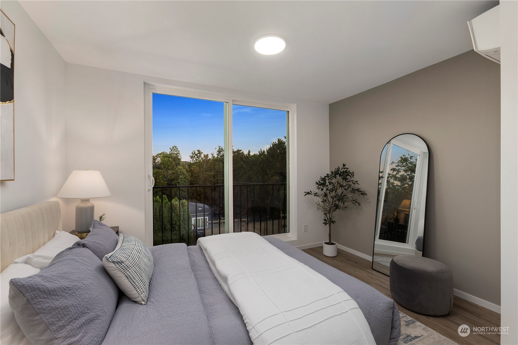 3102 South Walden Street Seattle, WA 98144 - Photo 20 of 35 a bedroom with a bed lamp and a large window